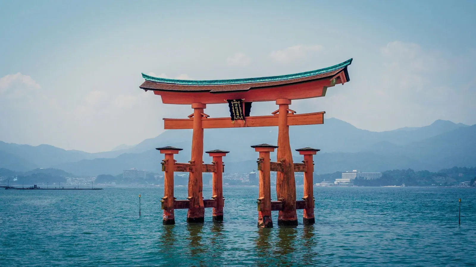 The vermilion torii of Itsukushima Shrine in the water at Miyajima